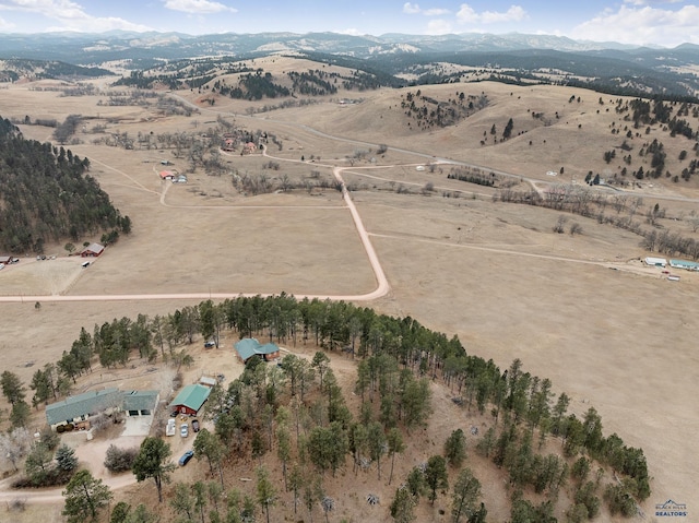 aerial view featuring a mountain view and a rural view