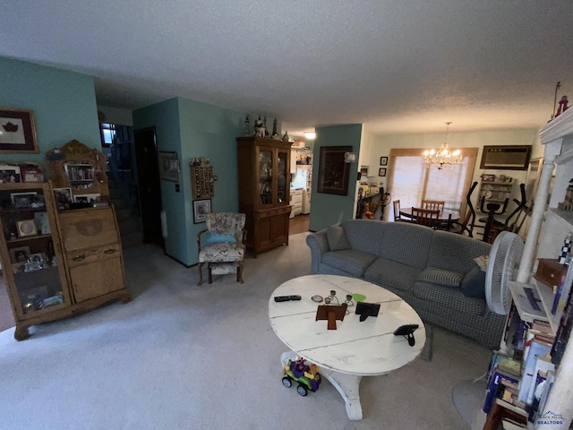 carpeted living room featuring a textured ceiling, a wall mounted AC, and an inviting chandelier