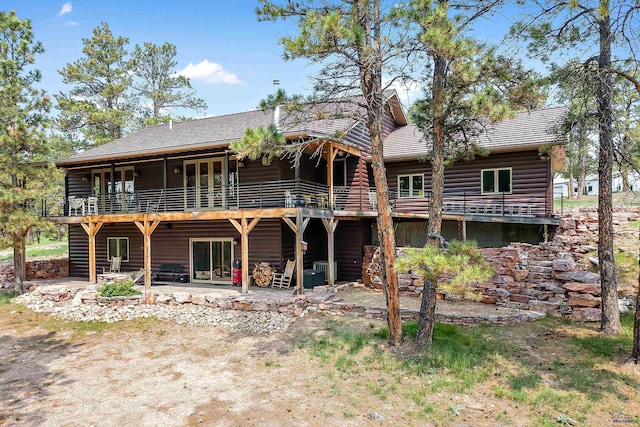 rear view of property with a patio area