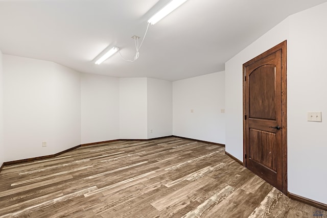 unfurnished room featuring dark hardwood / wood-style floors