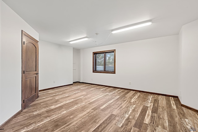 spare room featuring hardwood / wood-style floors