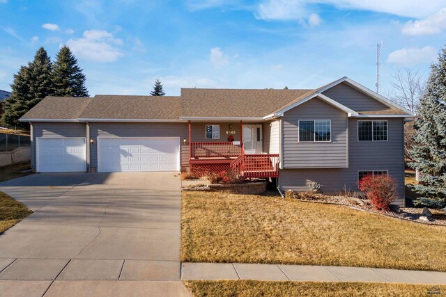 ranch-style home with a front yard and a garage