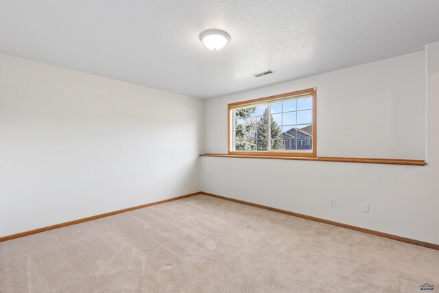 unfurnished room with carpet flooring