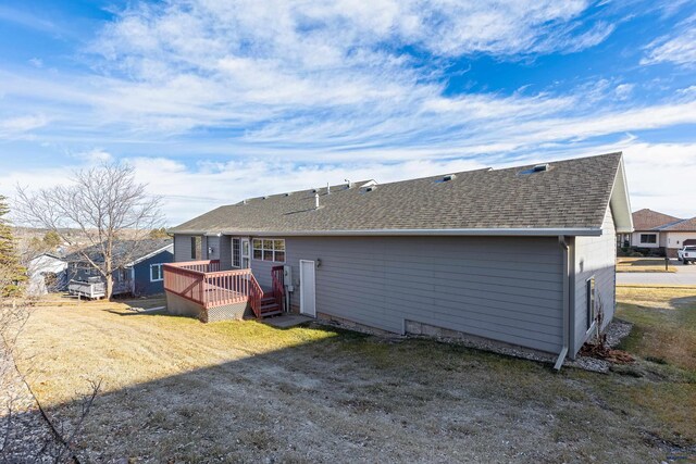 back of house with a wooden deck