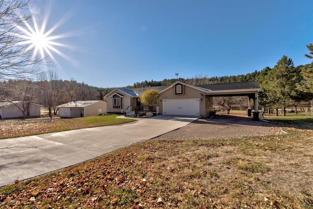 single story home with a front yard, a garage, and a carport