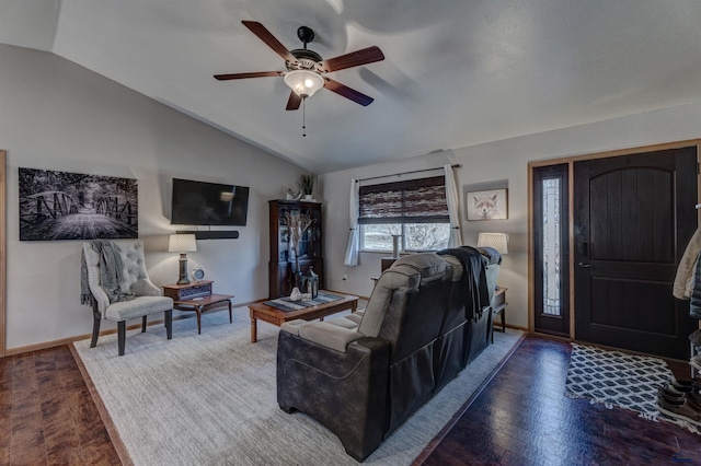 living room with hardwood / wood-style flooring, vaulted ceiling, and ceiling fan