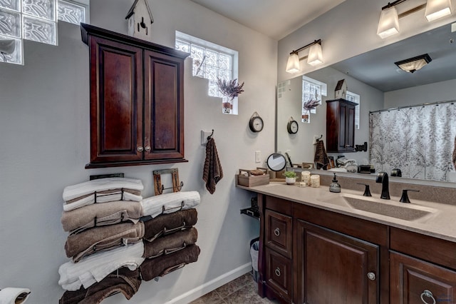 bathroom with tile patterned flooring and vanity