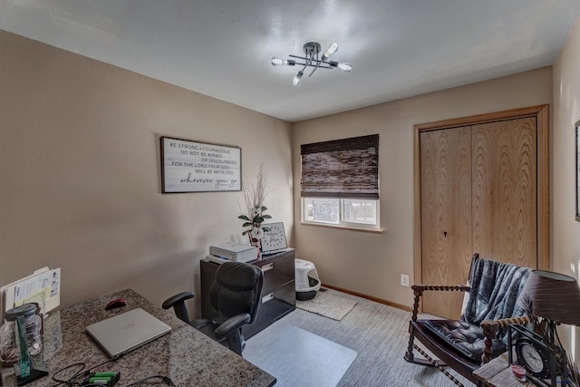 office featuring a chandelier