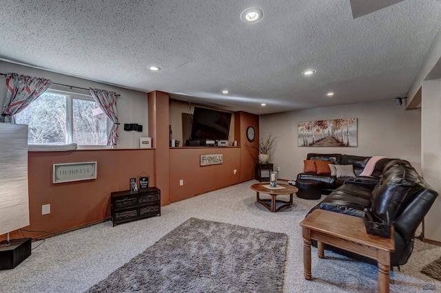 carpeted living room featuring a textured ceiling