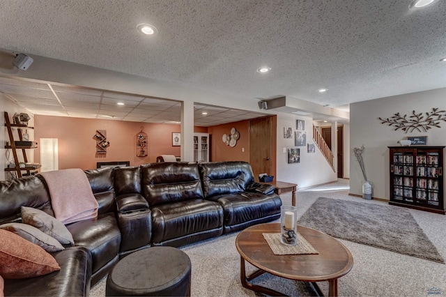 living room with carpet and a textured ceiling