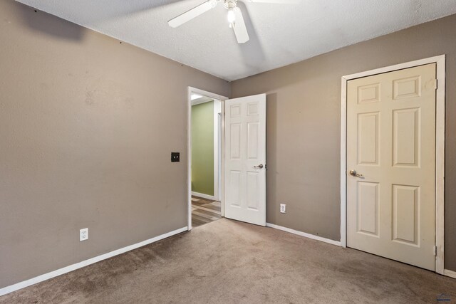 210 E Montana, Rapid City, SD 57701 - unfurnished bedroom with a ceiling fan, light carpet, a textured ceiling, and baseboards