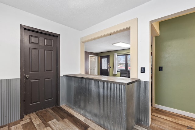210 E Montana, Rapid City, SD 57701 - interior space featuring a textured ceiling, baseboards, and dark wood-type flooring