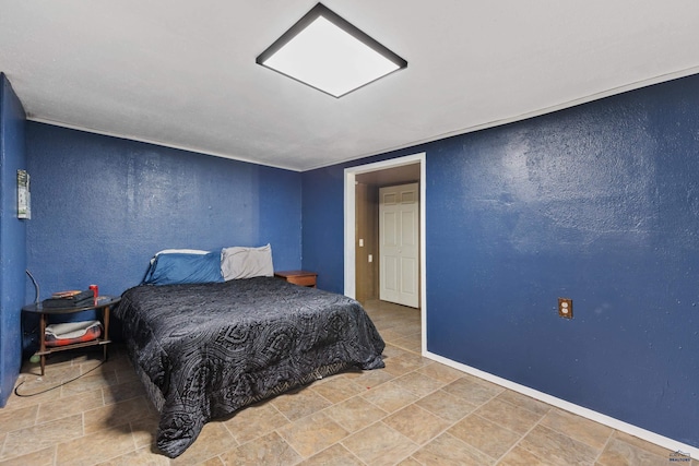 210 E Montana, Rapid City, SD 57701 - bedroom featuring stone finish floor and a textured wall