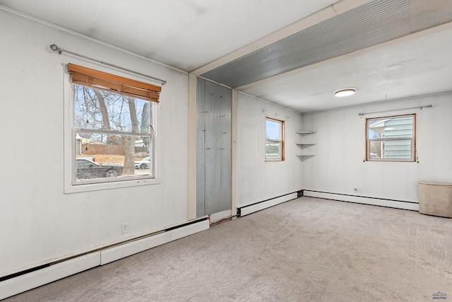 210 E Montana, Rapid City, SD 57701 - carpeted empty room featuring a baseboard heating unit