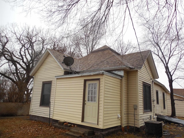 view of side of property with central AC unit