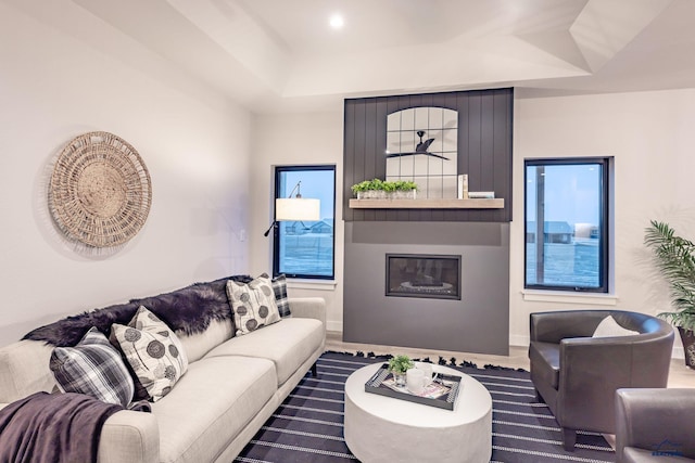 living room featuring a raised ceiling