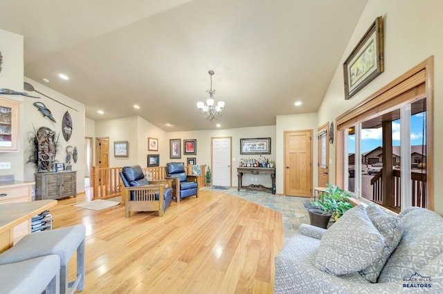 living room featuring light hardwood / wood-style flooring and an inviting chandelier