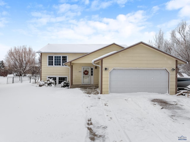 view of front of property with a garage