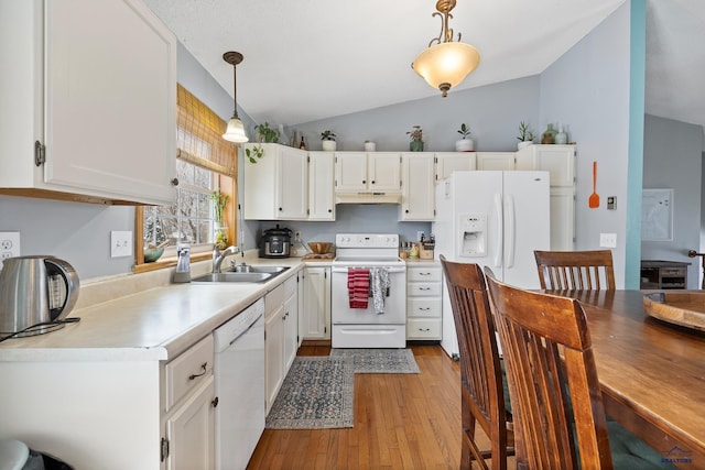 kitchen featuring white cabinets, decorative light fixtures, white appliances, and sink