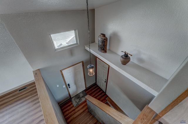 staircase featuring hardwood / wood-style floors