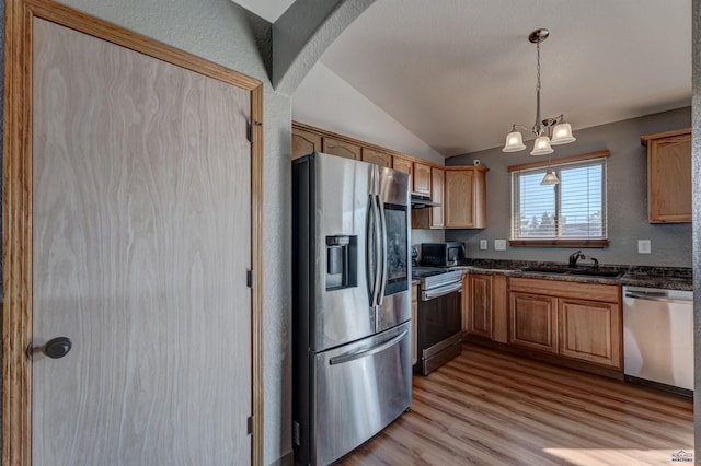 kitchen featuring lofted ceiling with beams, sink, light hardwood / wood-style flooring, appliances with stainless steel finishes, and a chandelier