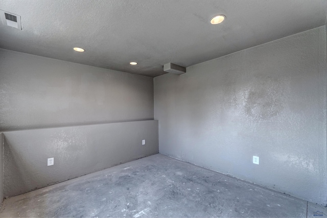 spare room featuring concrete floors