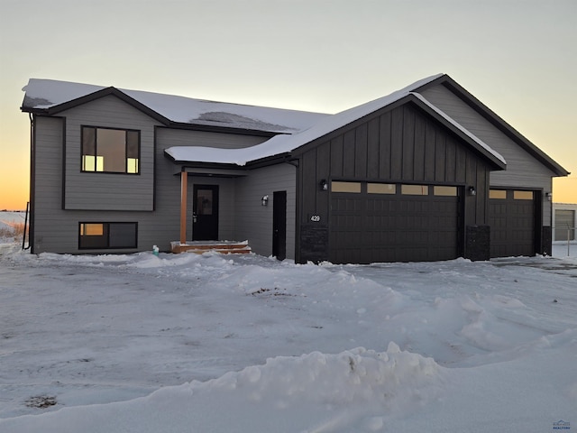 modern farmhouse style home featuring a garage