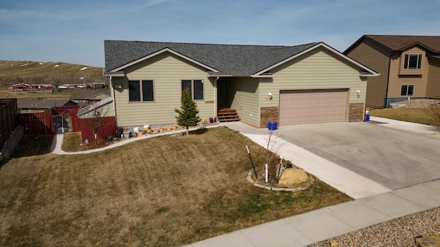 view of front facade featuring a front yard and a garage