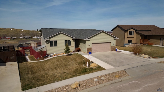 single story home with a garage and a front yard