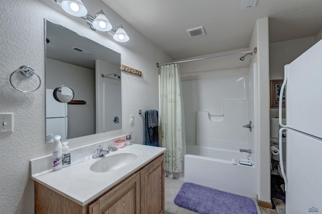 bathroom featuring vanity and shower / bath combo with shower curtain