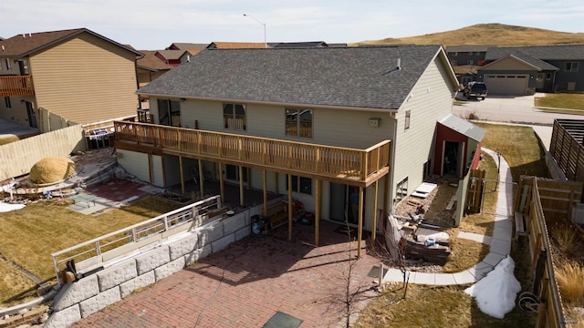 back of property with a wooden deck