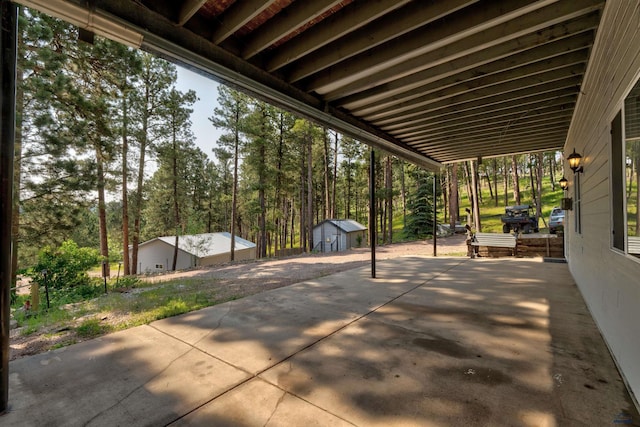 view of patio featuring a storage unit