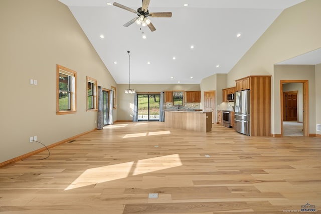 unfurnished living room featuring recessed lighting, a ceiling fan, high vaulted ceiling, light wood-type flooring, and baseboards