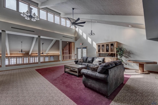 carpeted living room featuring beam ceiling, ceiling fan with notable chandelier, high vaulted ceiling, and french doors