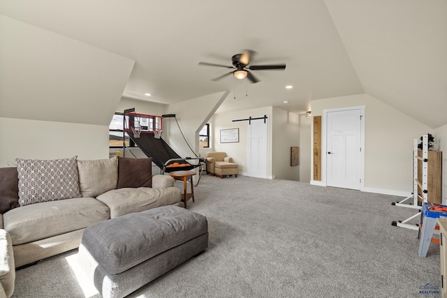 living room featuring a barn door, ceiling fan, carpet floors, and lofted ceiling