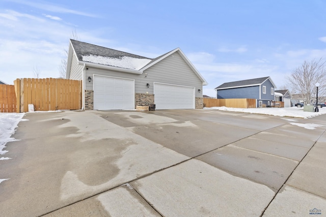 view of side of property featuring a garage