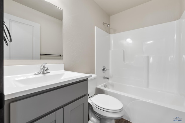 full bathroom featuring vanity, toilet, and tub / shower combination