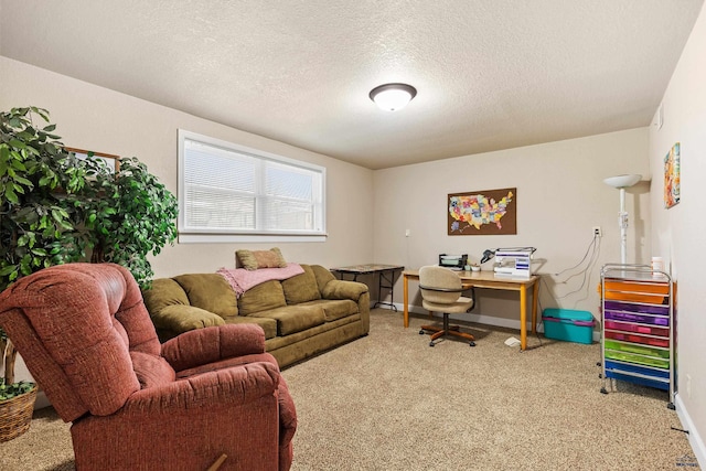 carpeted office space featuring a textured ceiling