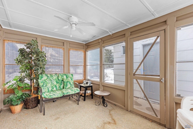 sunroom featuring ceiling fan