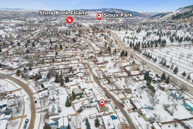 snowy aerial view with a mountain view