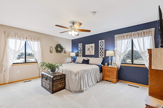 carpeted bedroom featuring ceiling fan