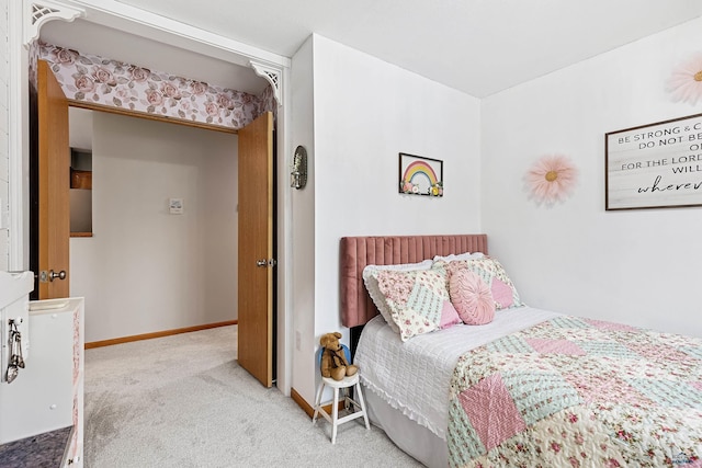 bedroom featuring light carpet