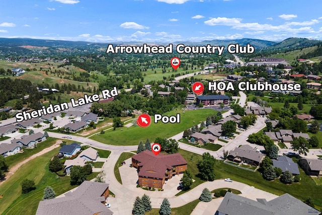 birds eye view of property featuring a mountain view