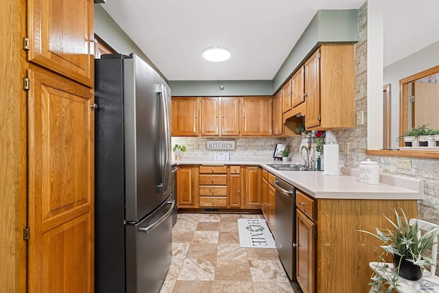 kitchen with tasteful backsplash, sink, and stainless steel appliances