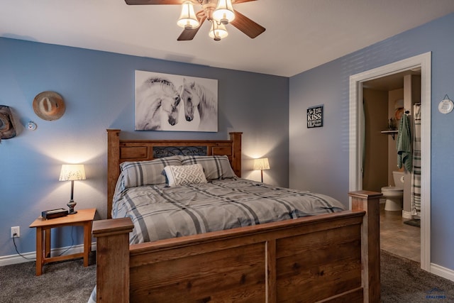 bedroom featuring dark colored carpet, ceiling fan, and ensuite bathroom