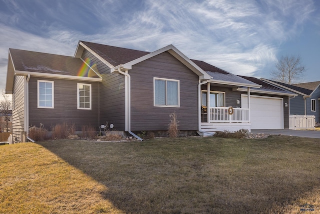 single story home with covered porch, a front lawn, and a garage