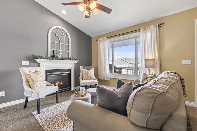 carpeted living room featuring lofted ceiling and ceiling fan