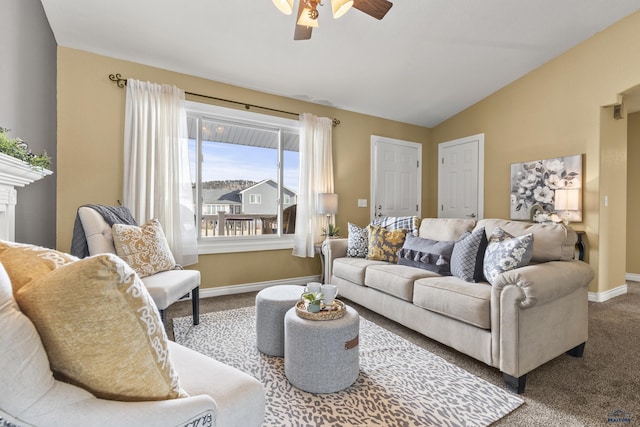 living room with ceiling fan, carpet flooring, and vaulted ceiling