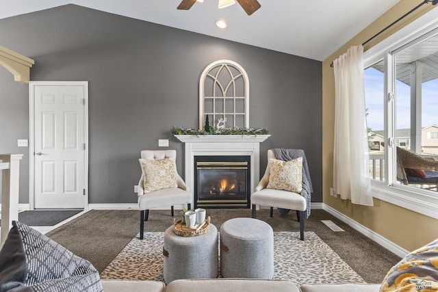 carpeted living room featuring lofted ceiling and ceiling fan