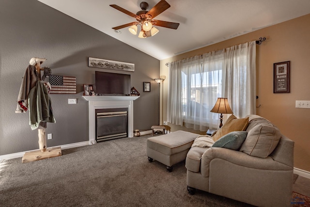 carpeted living room with ceiling fan and lofted ceiling